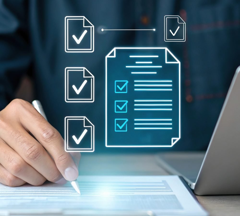 Person signing document with checklist icons